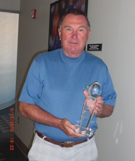 Rich Brooks with the Blanton Collier award trophy